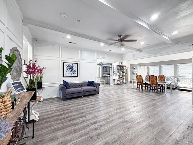 a room with a wooden floor and furniture