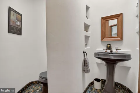 a bedroom with a bed and a desk