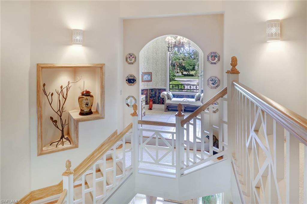 4588 Silver Fox Drive Naples, FL 34119 - Photo 14 of 35 a view of entryway and hall with wooden floor