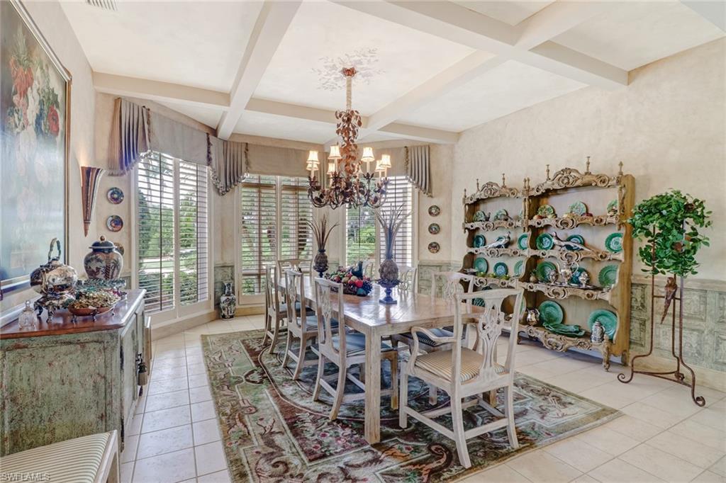 4588 Silver Fox Drive Naples, FL 34119 - Photo 15 of 35 a view of a dining room with furniture and chandelier
