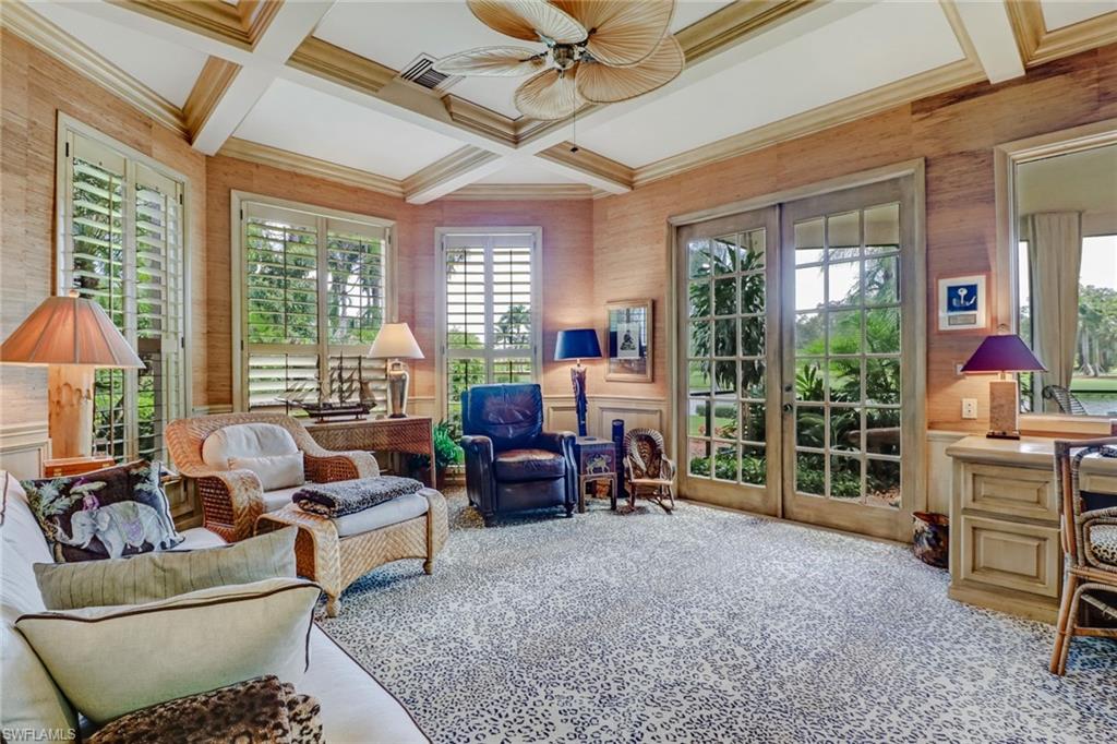4588 Silver Fox Drive Naples, FL 34119 - Photo 16 of 35 a living room with furniture and a large window