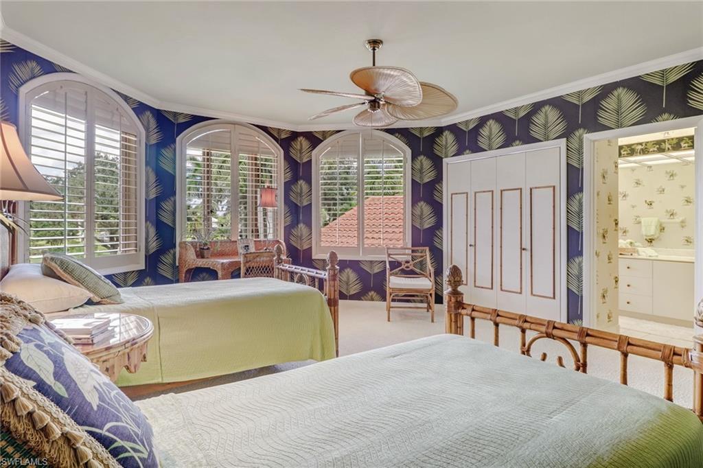 4588 Silver Fox Drive Naples, FL 34119 - Photo 23 of 35 a living room with fireplace furniture and a large window