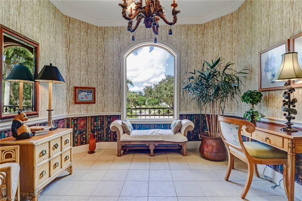 4588 Silver Fox Drive Naples, FL 34119 - Photo 24 of 35 a living room with furniture and a large window
