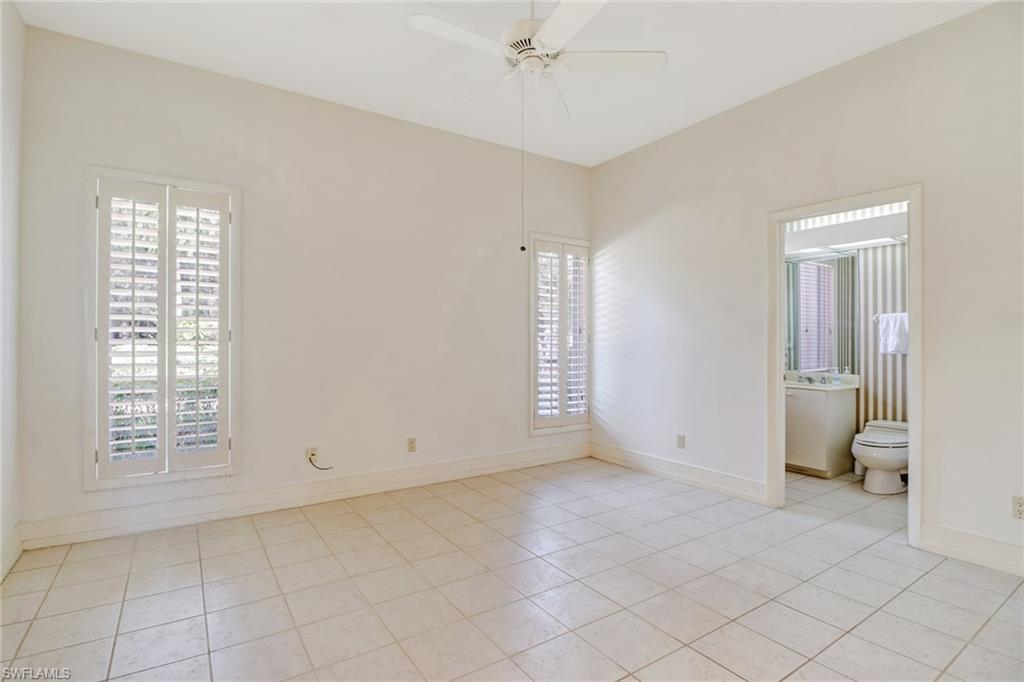 4588 Silver Fox Drive Naples, FL 34119 - Photo 26 of 35 a view of an empty room with a window