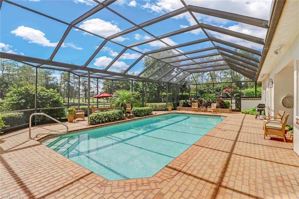 4588 Silver Fox Drive Naples, FL 34119 - Photo 27 of 35 a view of a swimming pool with a patio