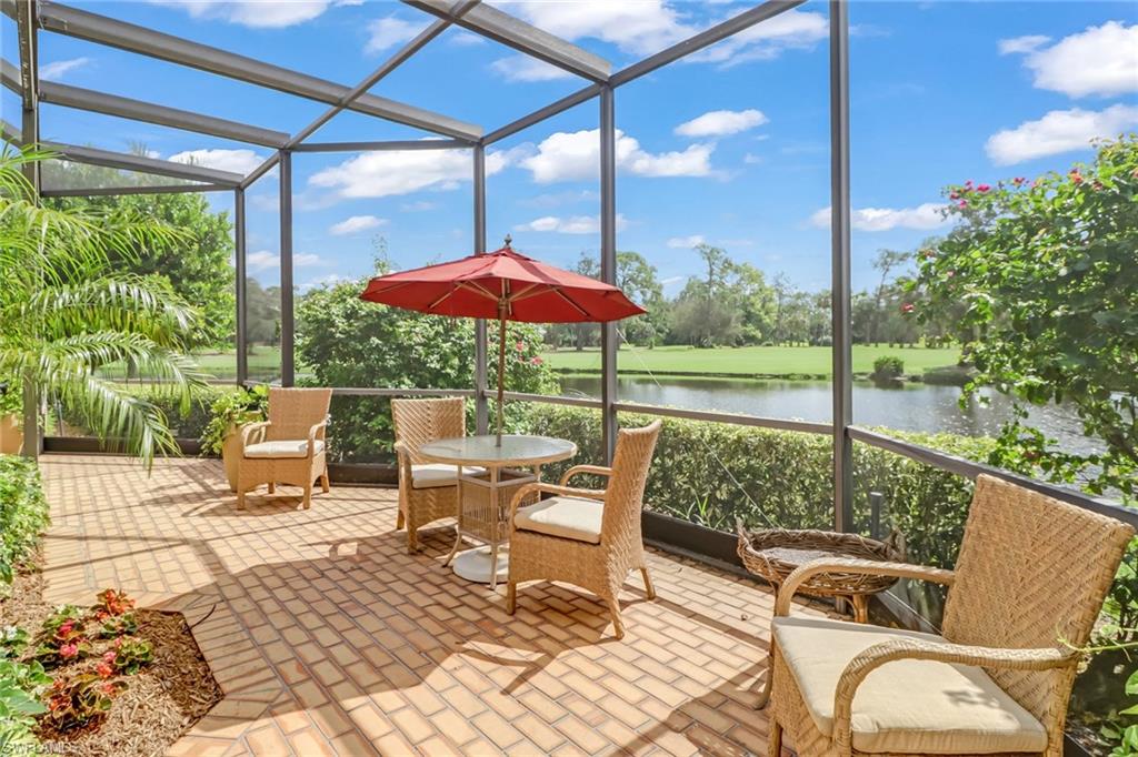 4588 Silver Fox Drive Naples, FL 34119 - Photo 28 of 35 a view of chair and tables in the patio