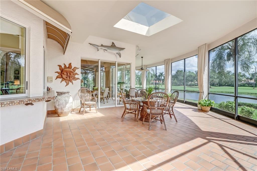 4588 Silver Fox Drive Naples, FL 34119 - Photo 30 of 35 a dining room with furniture and large windows