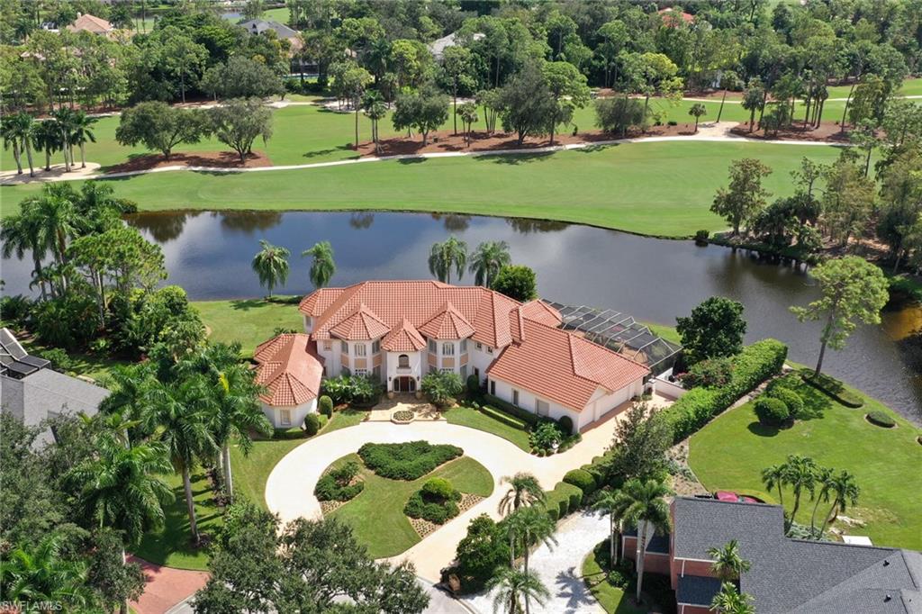 4588 Silver Fox Drive Naples, FL 34119 - Photo 34 of 35 an aerial view of a house with a yard and outdoor seating