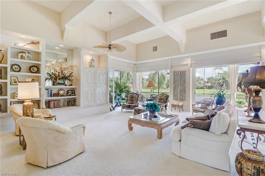4588 Silver Fox Drive Naples, FL 34119 - Photo 5 of 35 a living room with furniture and a large window