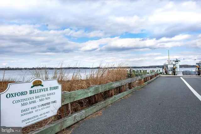 a view of a street next to a lake