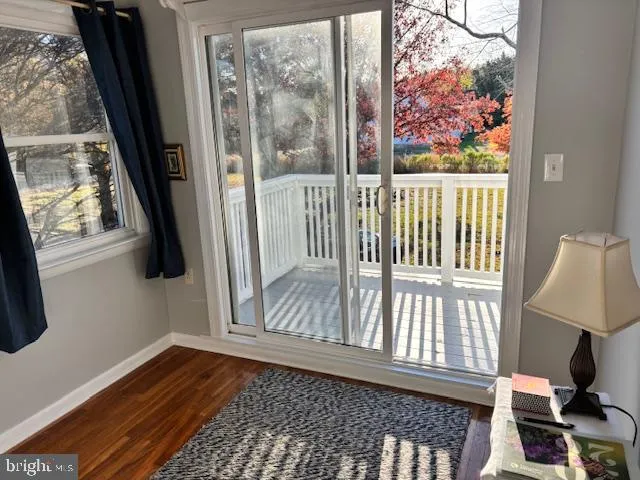 a view of a balcony with wooden floor