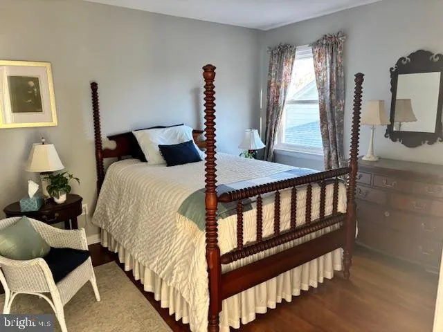 a bedroom with bed and a window