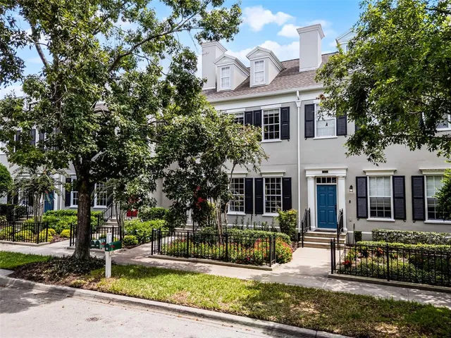 a view of empty room with wooden floor and window