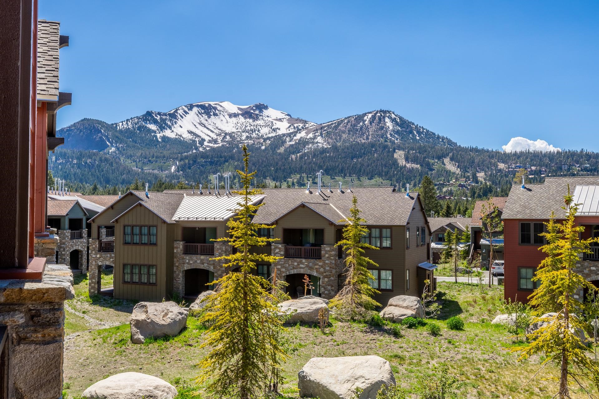 1353 Timber Creek Road, Unit 1353 Mammoth Lakes, CA 93546 - Photo 18 of 50 a front view of a house with a yard and mountain
