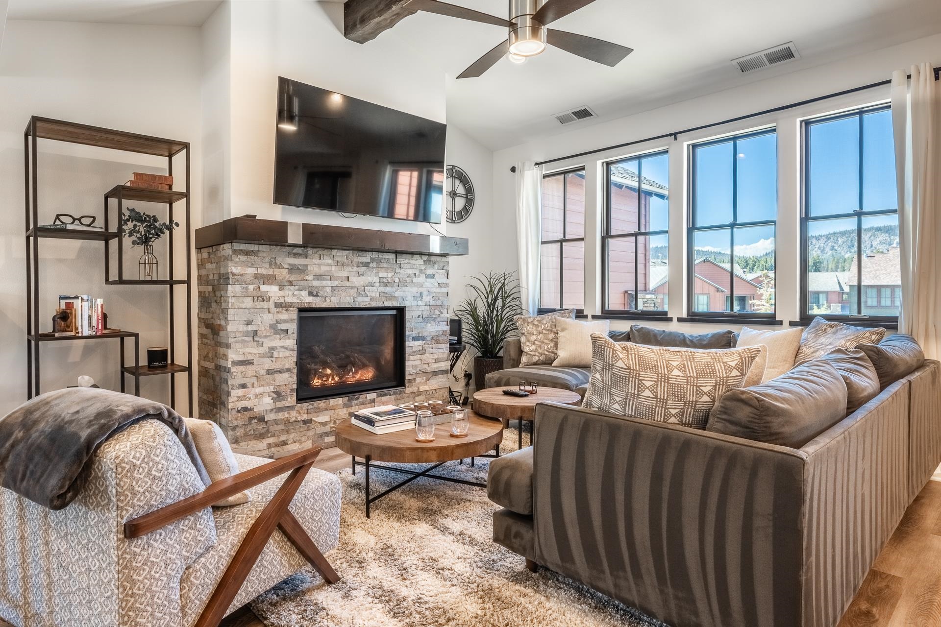 1353 Timber Creek Road, Unit 1353 Mammoth Lakes, CA 93546 - Photo 2 of 50 a living room with furniture a flat screen tv and a fireplace
