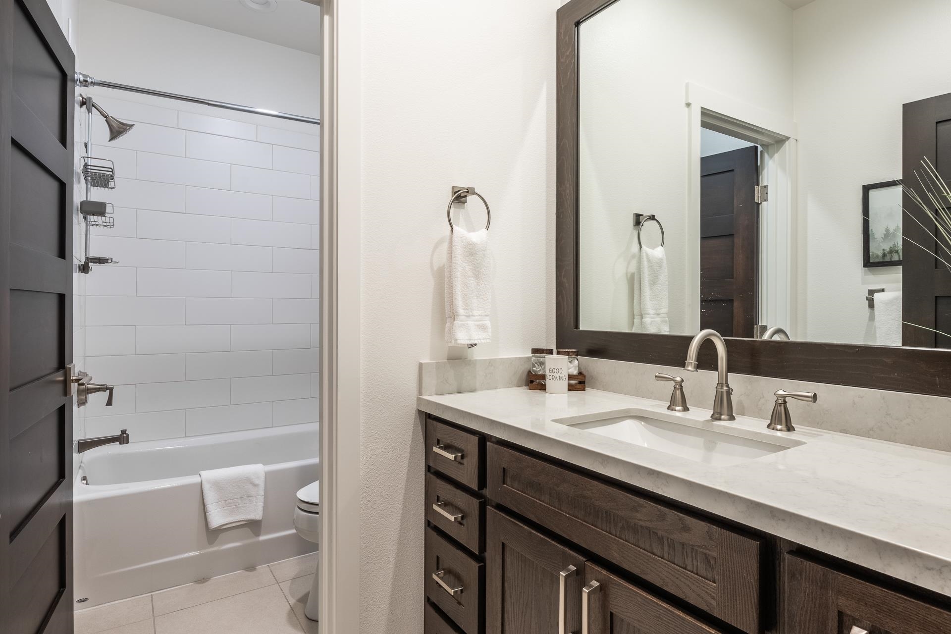 1353 Timber Creek Road, Unit 1353 Mammoth Lakes, CA 93546 - Photo 27 of 50 a bathroom with a double vanity sink mirror double and a bathtub