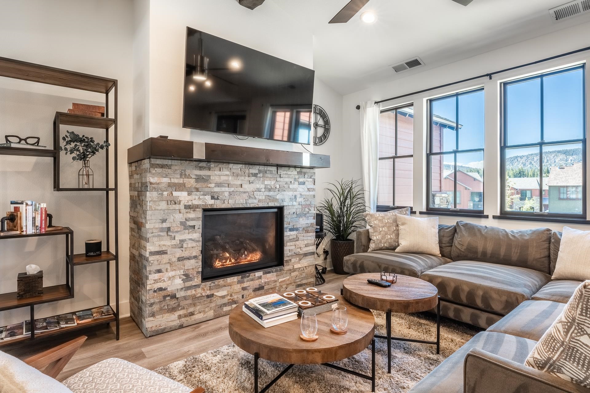 1353 Timber Creek Road, Unit 1353 Mammoth Lakes, CA 93546 - Photo 3 of 50 a living room with furniture a flat screen tv and a fireplace