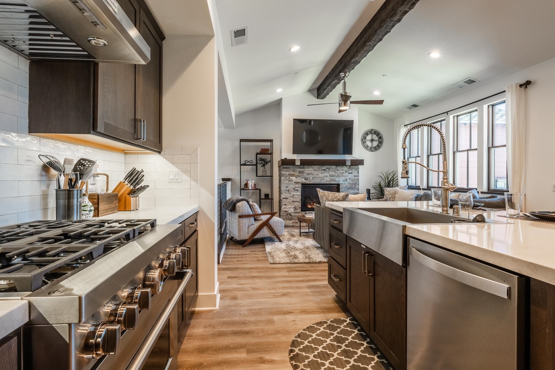 1353 Timber Creek Road, Unit 1353 Mammoth Lakes, CA 93546 - Photo 8 of 50 a kitchen with stainless steel appliances granite countertop a stove top oven a sink dishwasher and a microwave oven on the blue kitchen countertops