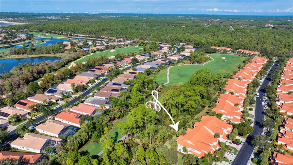 4695 Winged Foot Court, Unit 101 Naples, FL 34112 - Photo 16 of 23 an aerial view of city lake and residential houses with outdoor space