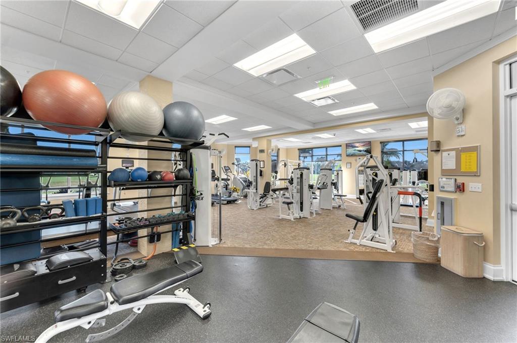 4695 Winged Foot Court, Unit 101 Naples, FL 34112 - Photo 22 of 23 a view of a room with gym equipment