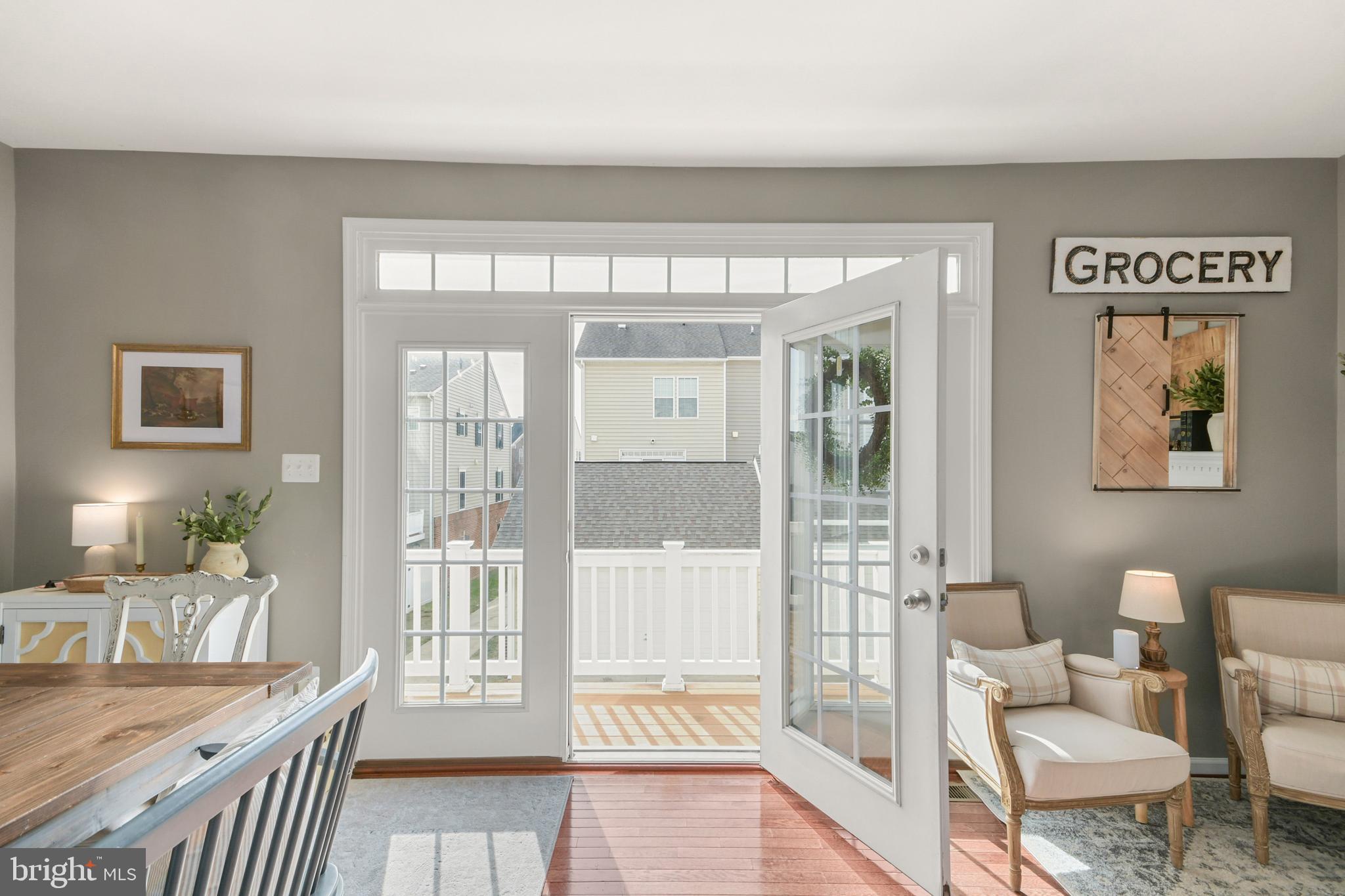 2709 Osprey Way North Frederick, MD 21701 - Photo 18 of 29 a living room with furniture and a floor to ceiling window