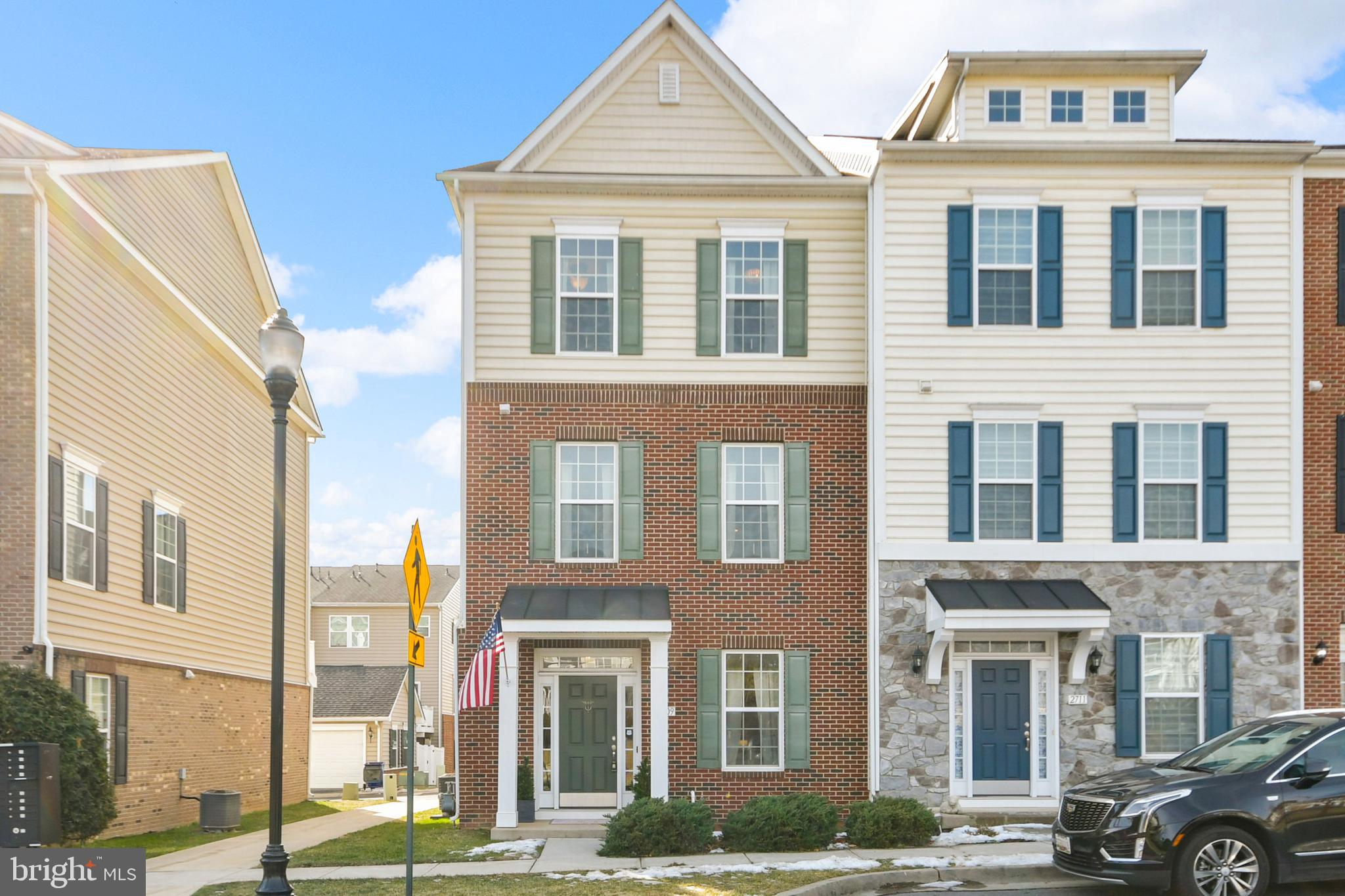 2709 Osprey Way North Frederick, MD 21701 - Photo 9 of 29 a front view of a residential apartment building with a yard