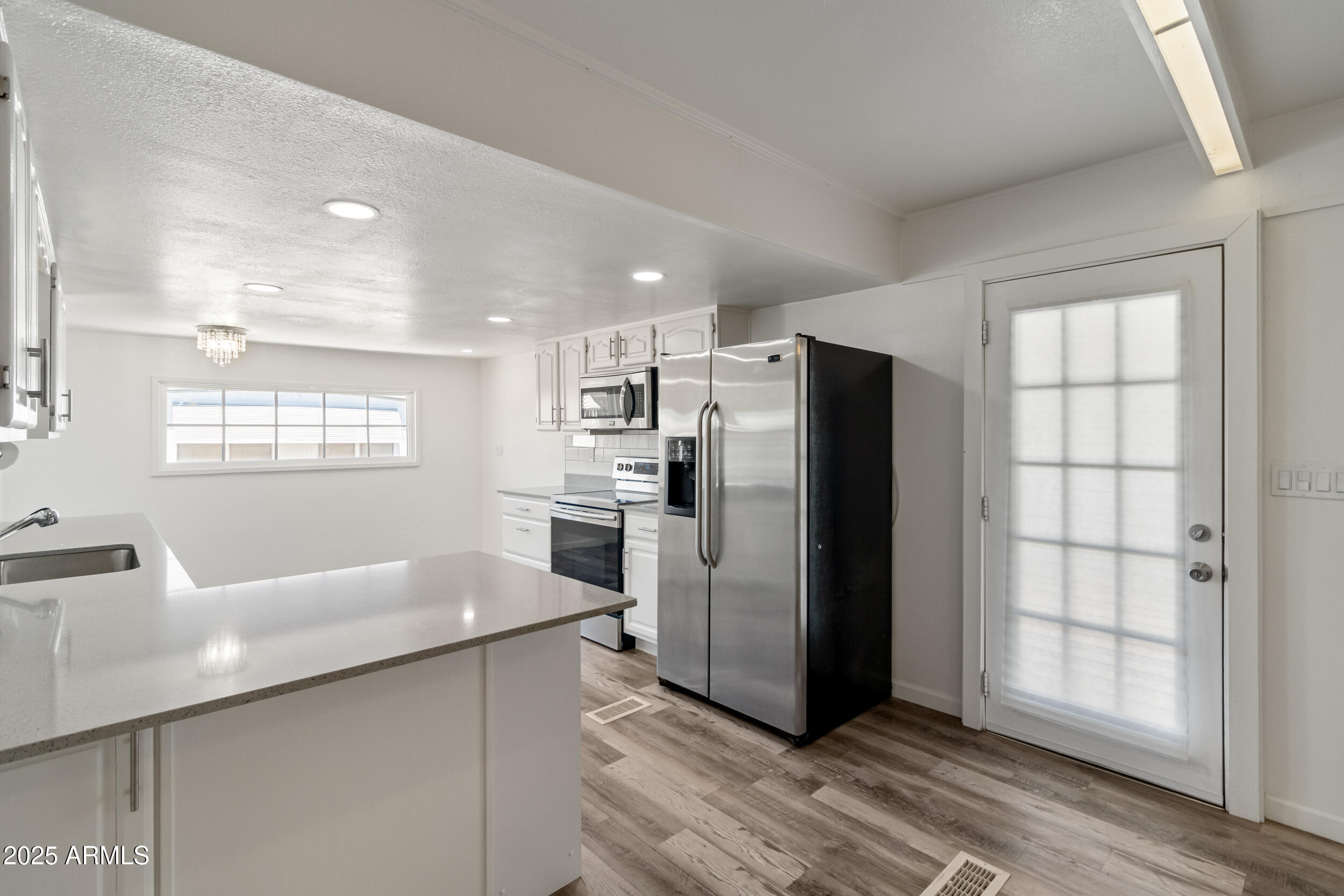 535 South Alma School Road, Unit 17 Mesa, AZ 85210 - Photo 1 of 58 a kitchen with stainless steel appliances a refrigerator sink and microwave