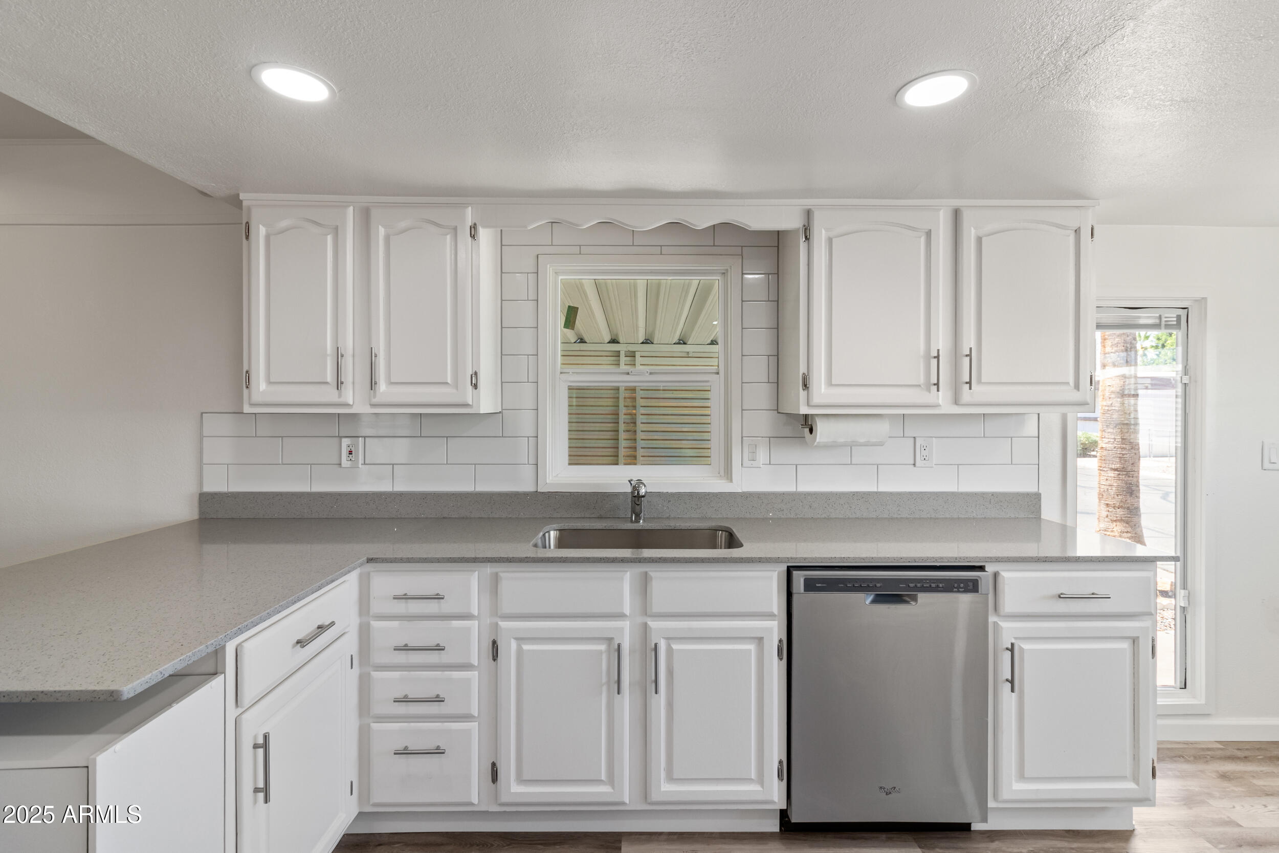 535 South Alma School Road, Unit 17 Mesa, AZ 85210 - Photo 15 of 58 a kitchen with white cabinets and sink
