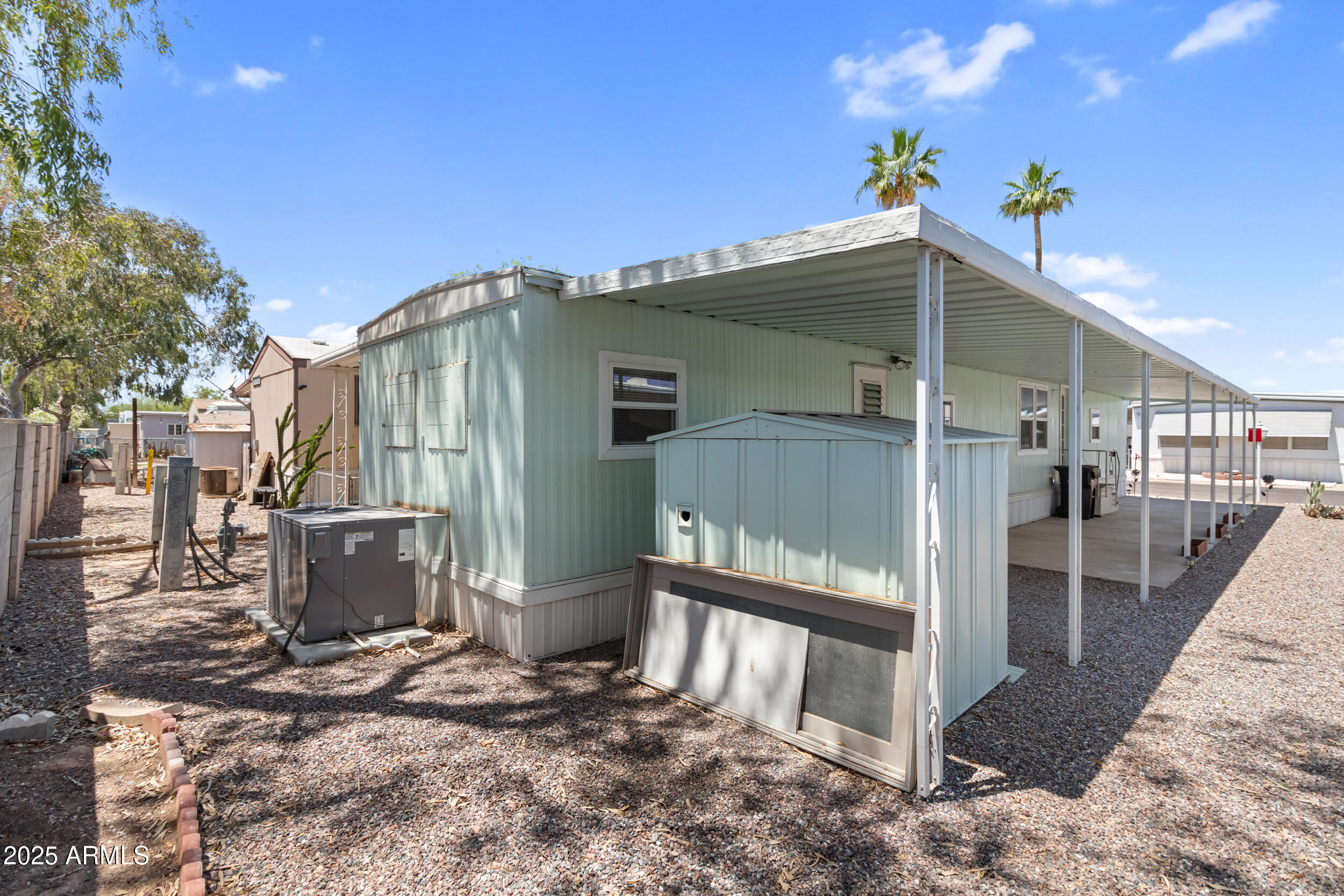 535 South Alma School Road, Unit 17 Mesa, AZ 85210 - Photo 26 of 58 a view of a house with a wooden fence
