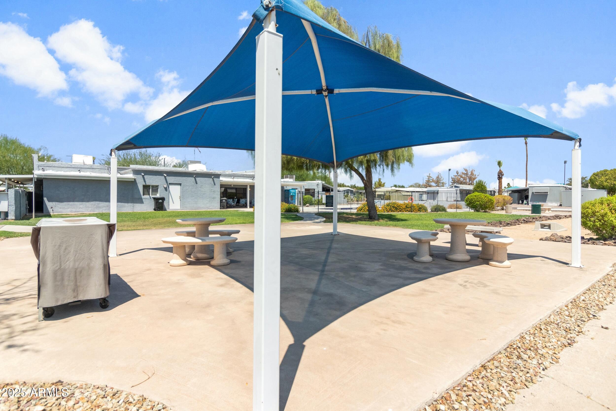 535 South Alma School Road, Unit 17 Mesa, AZ 85210 - Photo 27 of 58 a view of a swimming pool with a patio