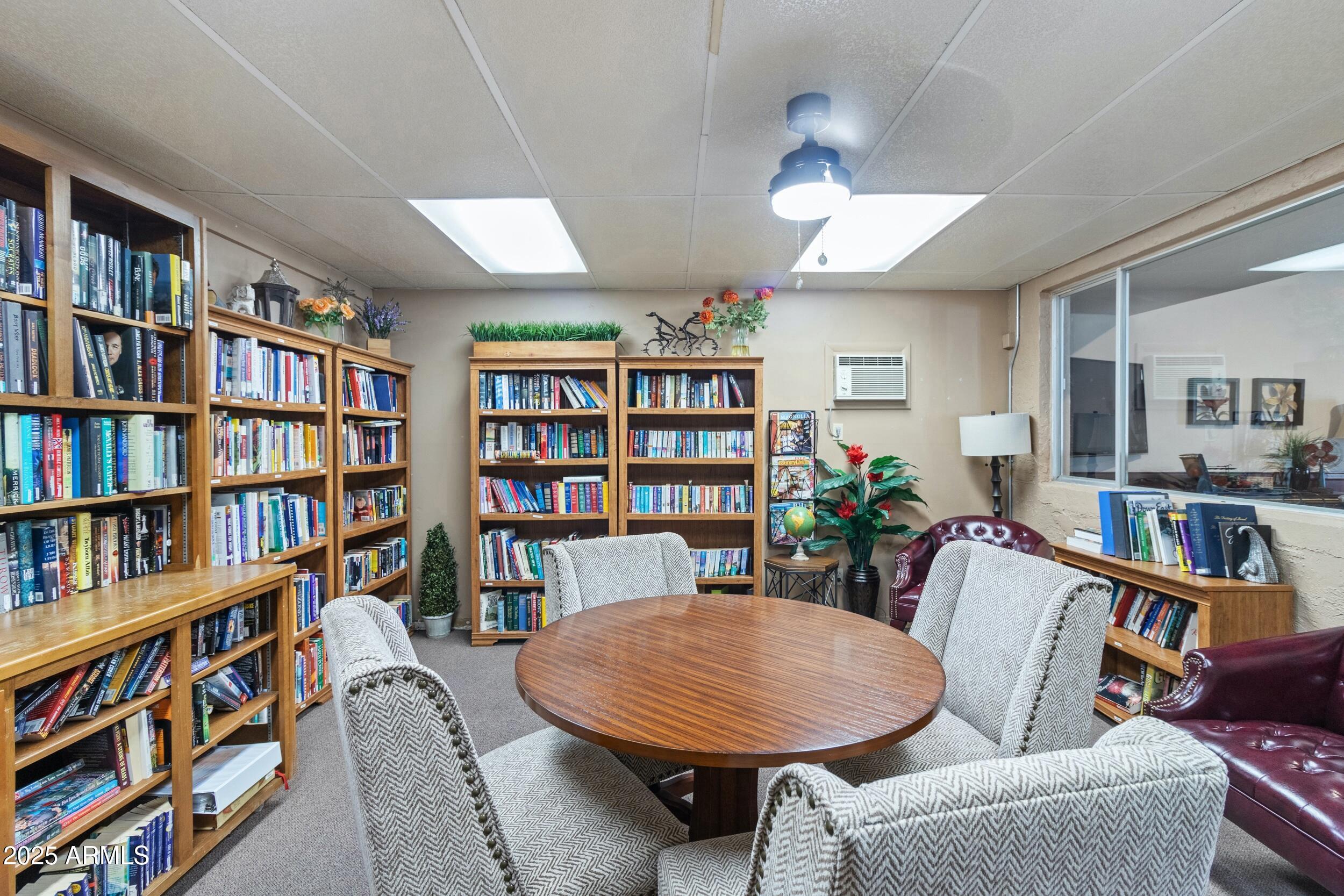 535 South Alma School Road, Unit 17 Mesa, AZ 85210 - Photo 33 of 58 a view of a livingroom with furniture and a bookshelf