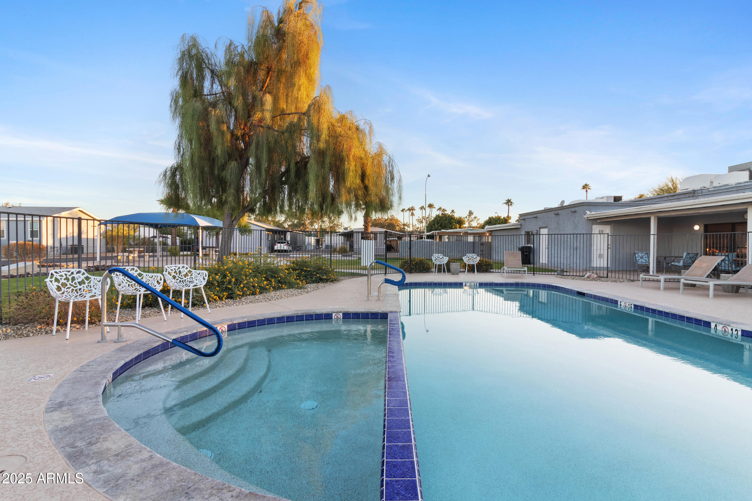 535 South Alma School Road, Unit 17 Mesa, AZ 85210 - Photo 45 of 58 a swimming pool with outdoor seating and yard