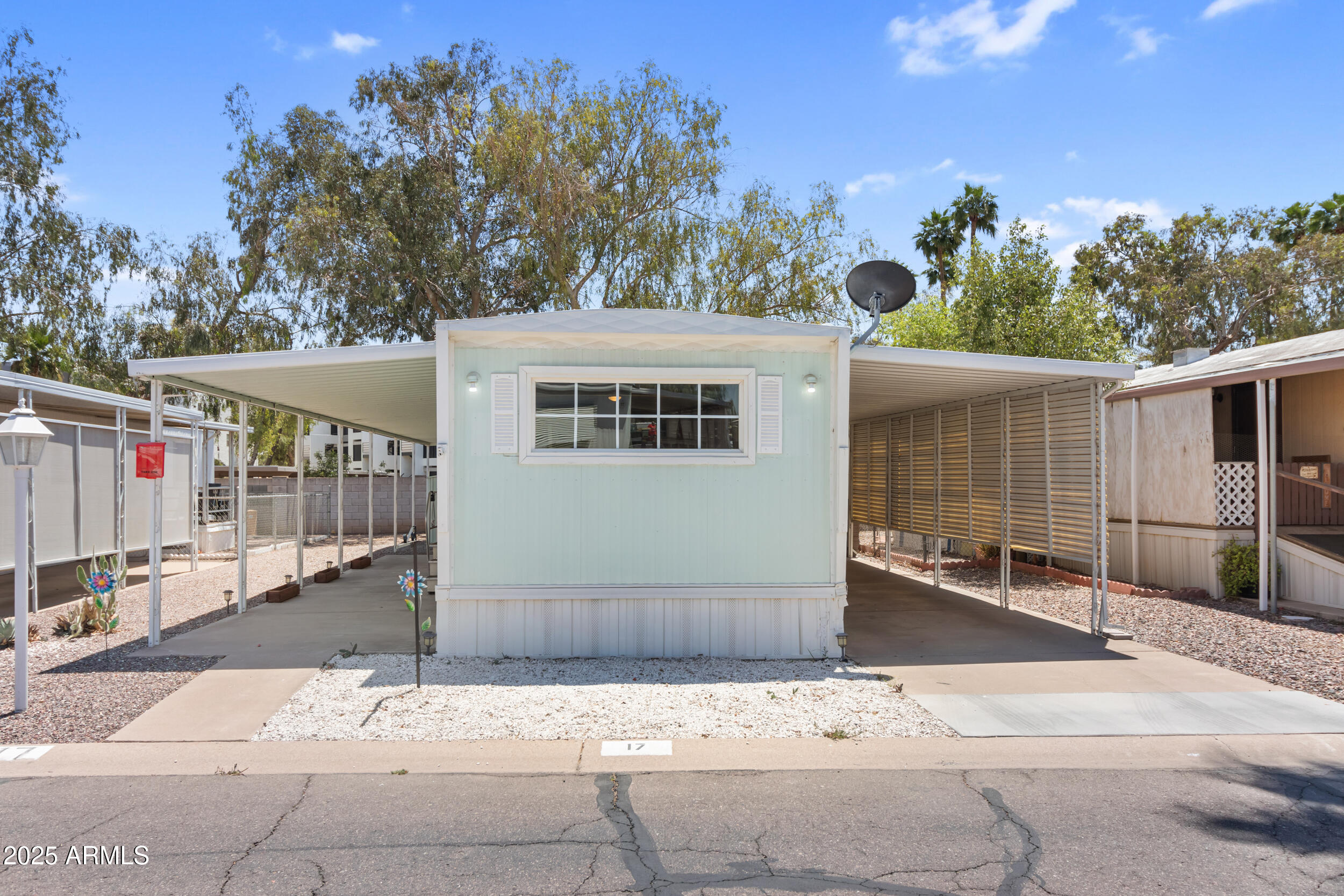 535 South Alma School Road, Unit 17 Mesa, AZ 85210 - Photo 5 of 58 a front view of a house with a garden