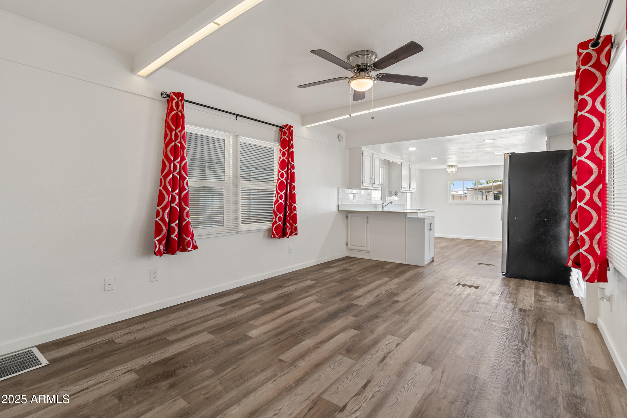 535 South Alma School Road, Unit 17 Mesa, AZ 85210 - Photo 7 of 58 a view of a room with wooden floor and ceiling fan