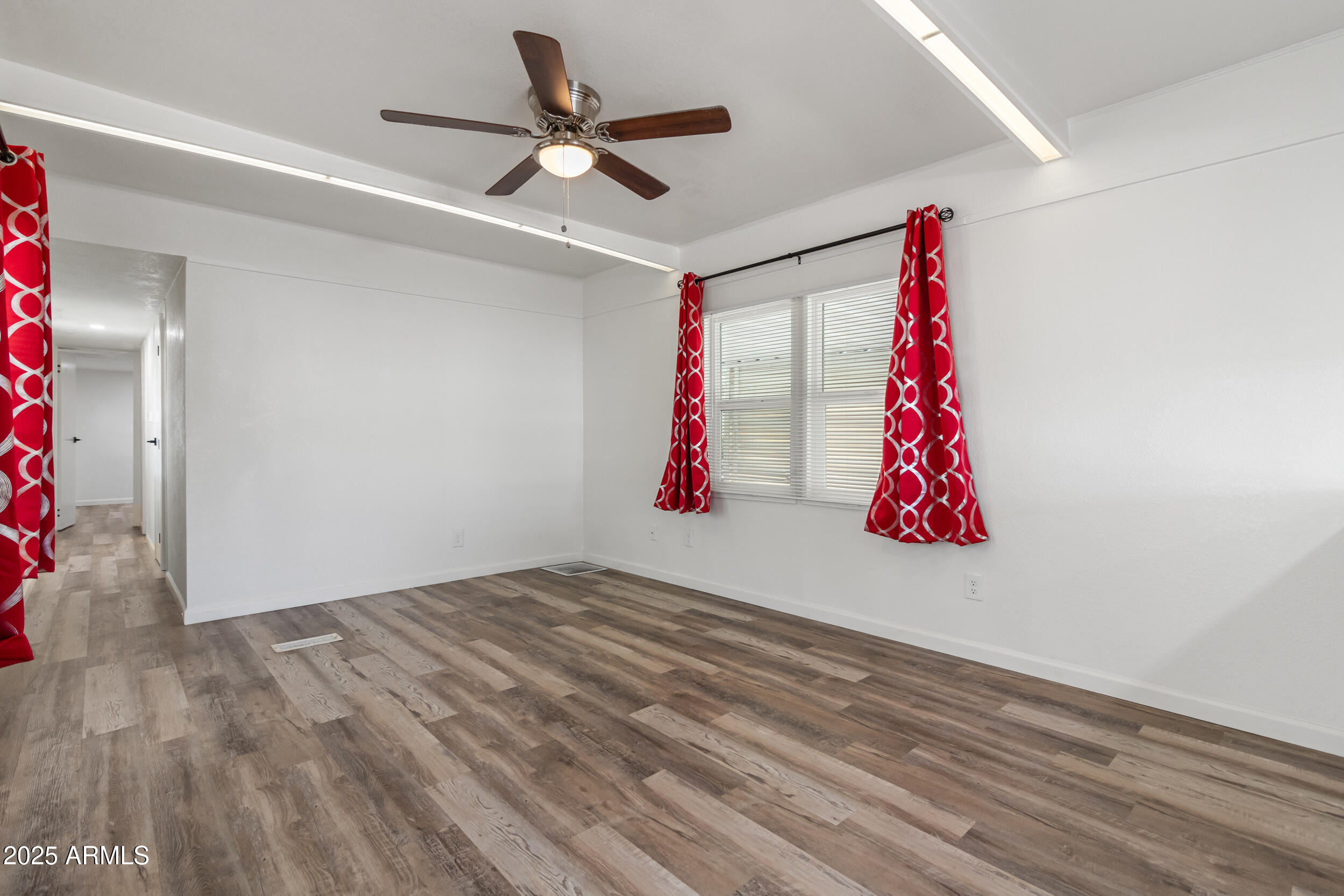 535 South Alma School Road, Unit 17 Mesa, AZ 85210 - Photo 9 of 58 a view of a room with wooden floor and ceiling fan
