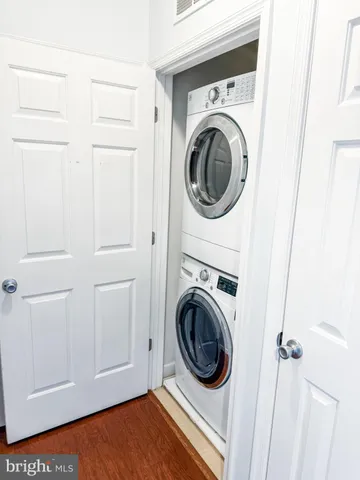 a view of a hallway with washer and dryer