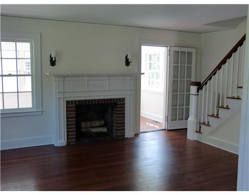 32 Sinawoy Road Cos Cob, CT 06807 - Photo 2 of 10 a view of an empty room with wooden floor fireplace and a window