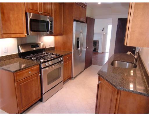 32 Sinawoy Road Cos Cob, CT 06807 - Photo 3 of 10 a kitchen with stainless steel appliances granite countertop a sink stove and refrigerator