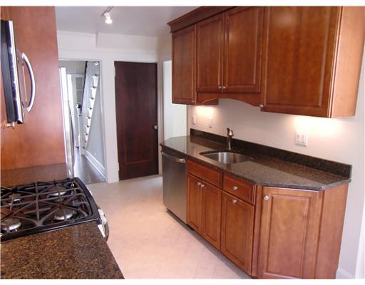 32 Sinawoy Road Cos Cob, CT 06807 - Photo 4 of 10 a kitchen with stainless steel appliances granite countertop a refrigerator and a sink