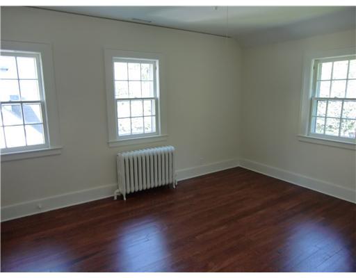 32 Sinawoy Road Cos Cob, CT 06807 - Photo 6 of 10 an empty room with wooden floor and windows
