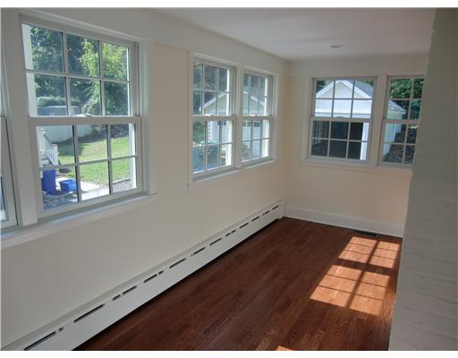 32 Sinawoy Road Cos Cob, CT 06807 - Photo 9 of 10 an empty room with wooden floor and windows