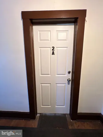 a view of an empty room and a window