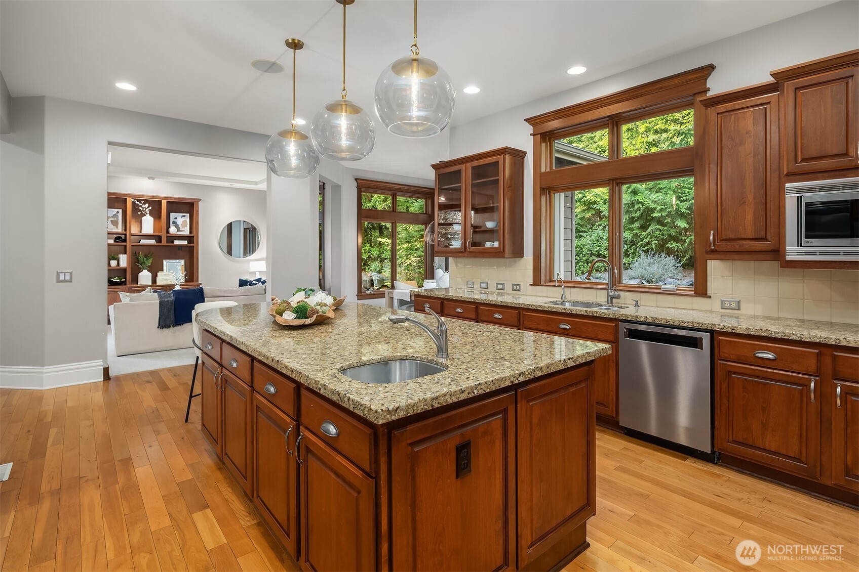 2989 Northeast Davis Loop Issaquah, WA 98029 - Photo 13 of 40 a kitchen with stainless steel appliances granite countertop wooden cabinets a center island and a window