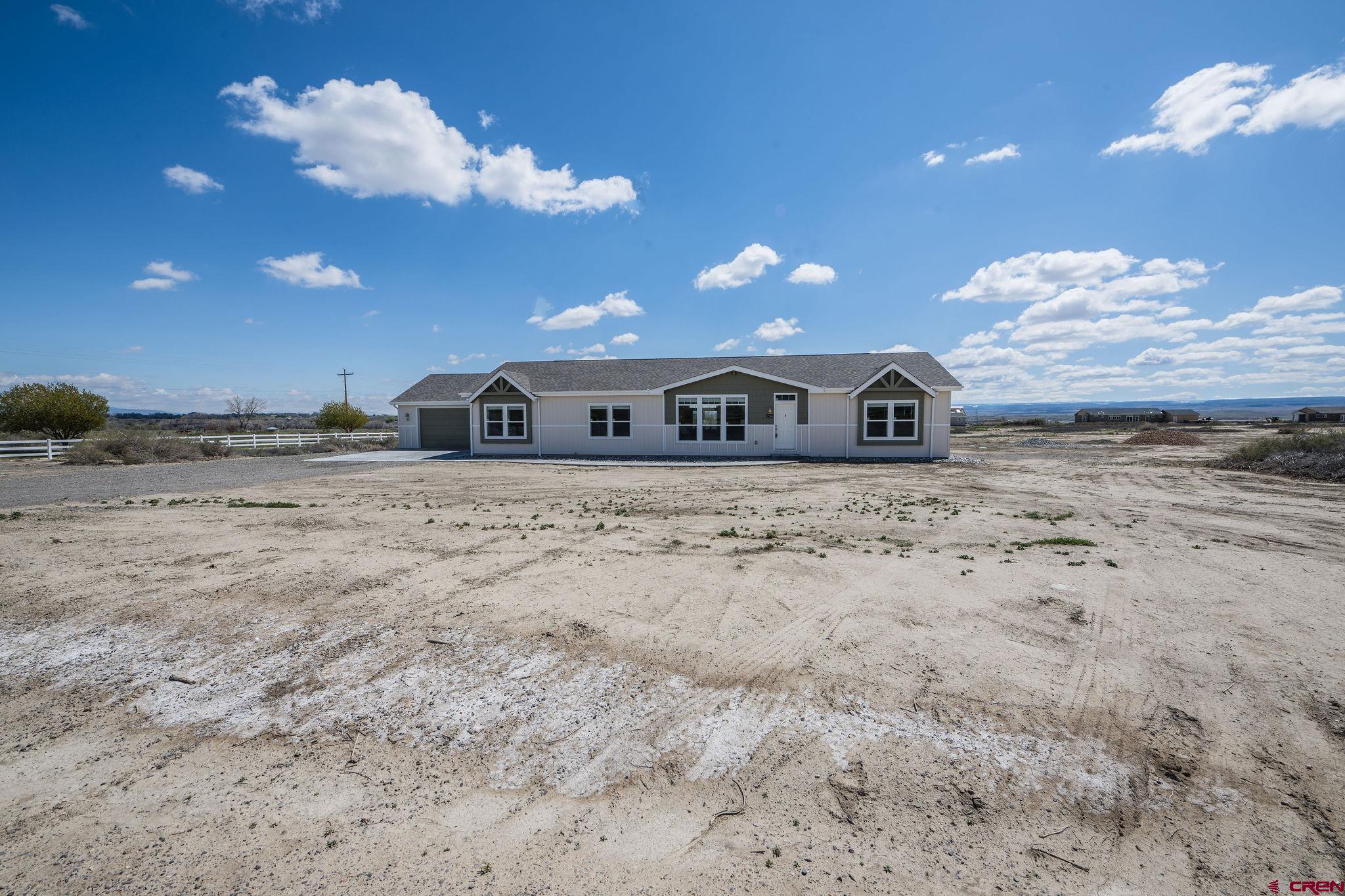 1246 H25 Road Delta, CO 81416 - Photo 1 of 31 a view of a big yard with table and chairs