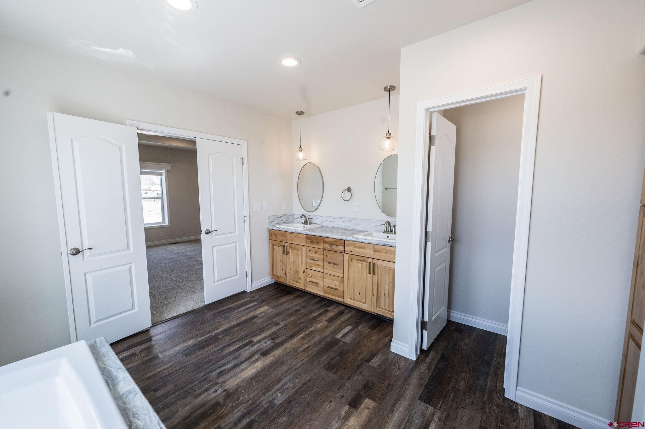 1246 H25 Road Delta, CO 81416 - Photo 15 of 31 a bedroom with a bed and a dresser