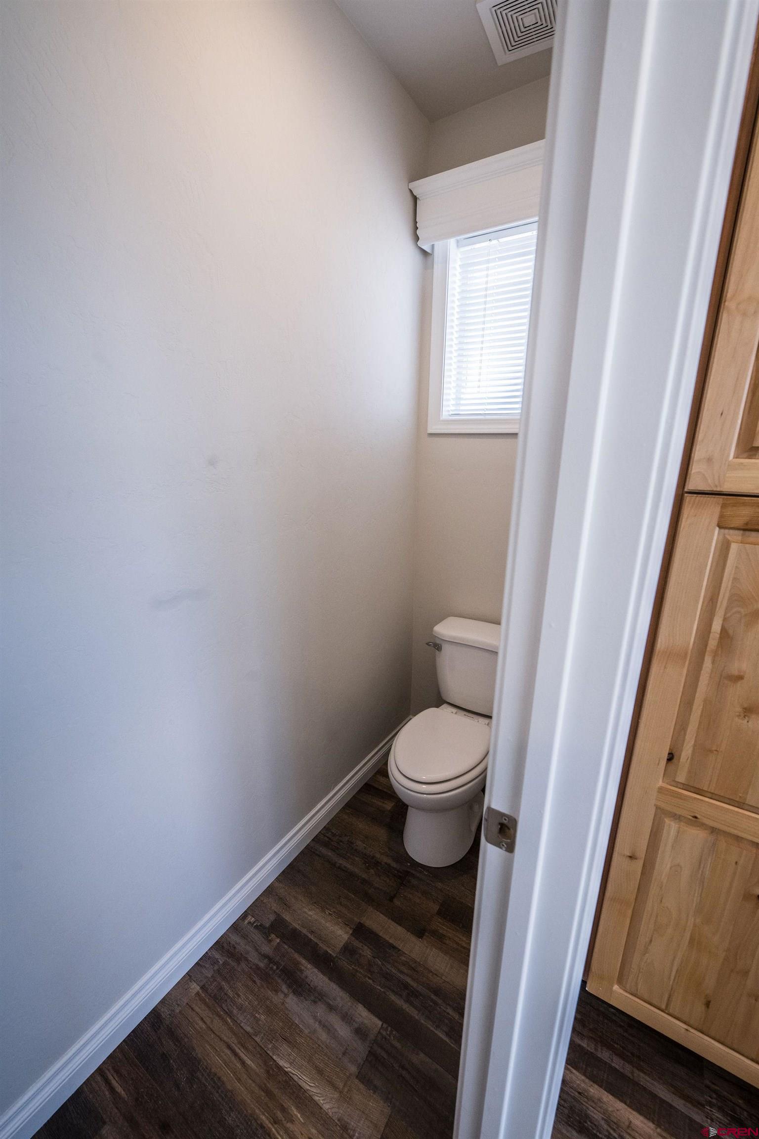 1246 H25 Road Delta, CO 81416 - Photo 16 of 31 a bathroom with a toilet and a sink