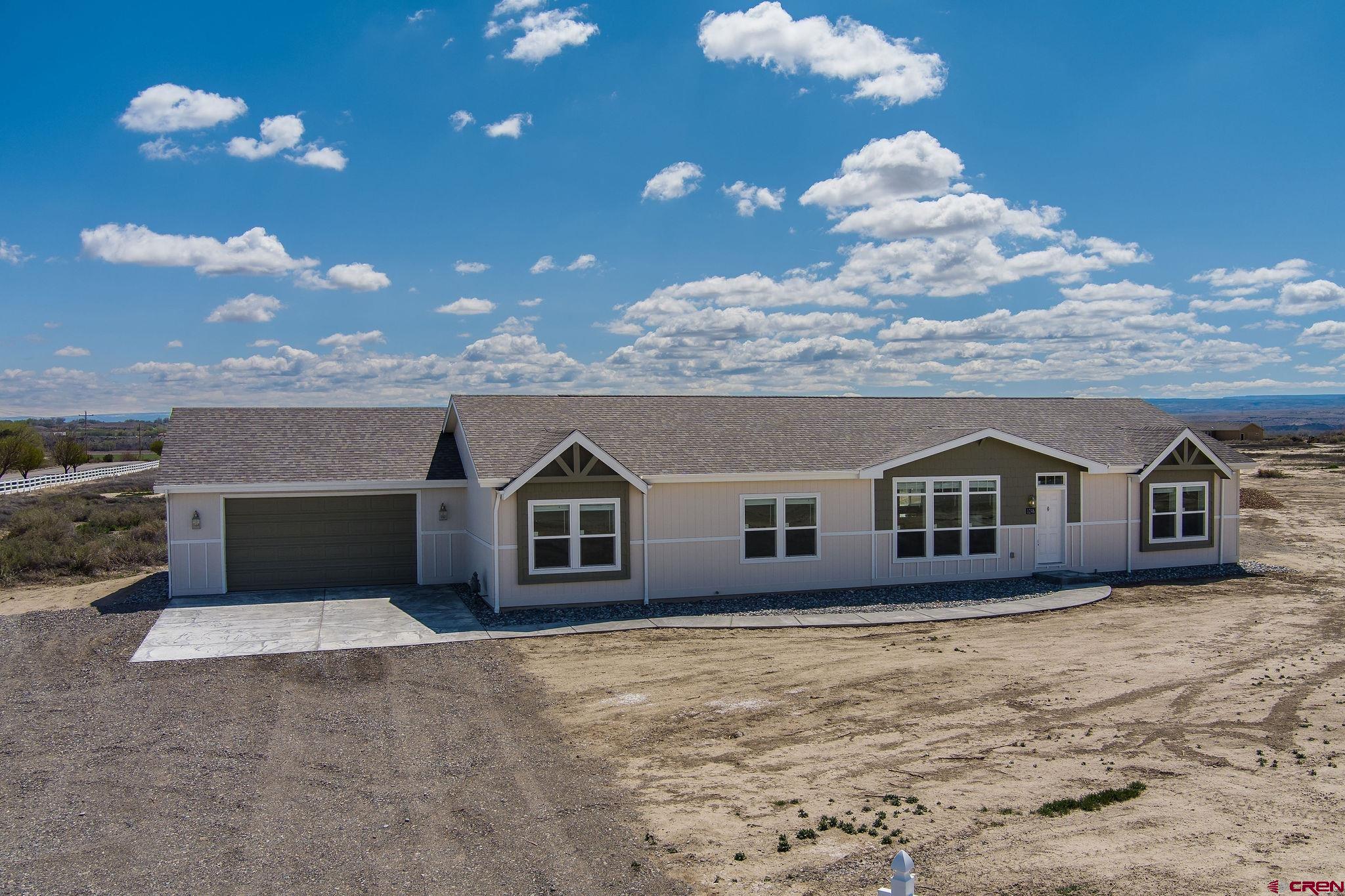 1246 H25 Road Delta, CO 81416 - Photo 20 of 31 a view of a house with a yard and roof