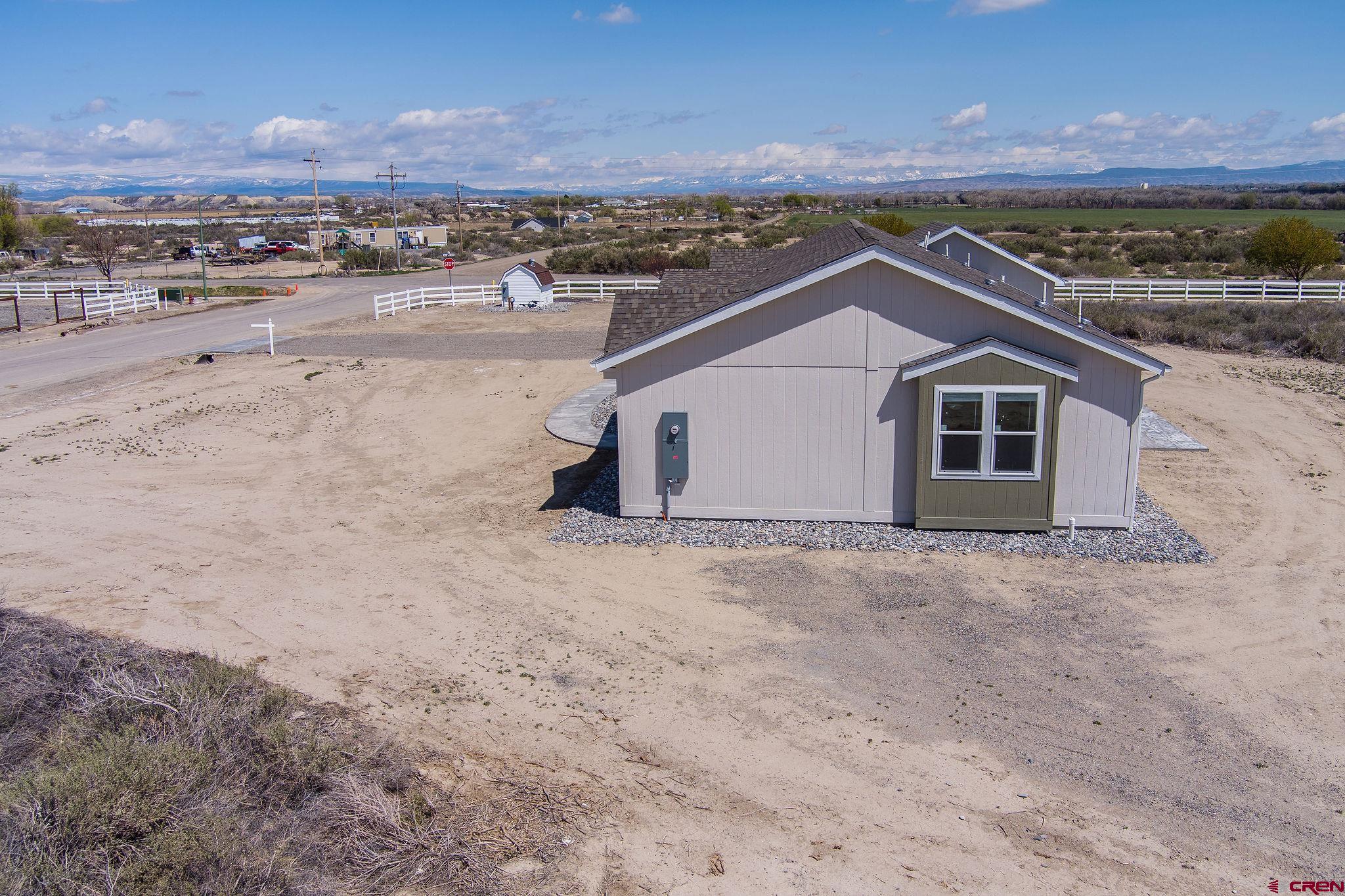 1246 H25 Road Delta, CO 81416 - Photo 22 of 31 a view of a house with a yard