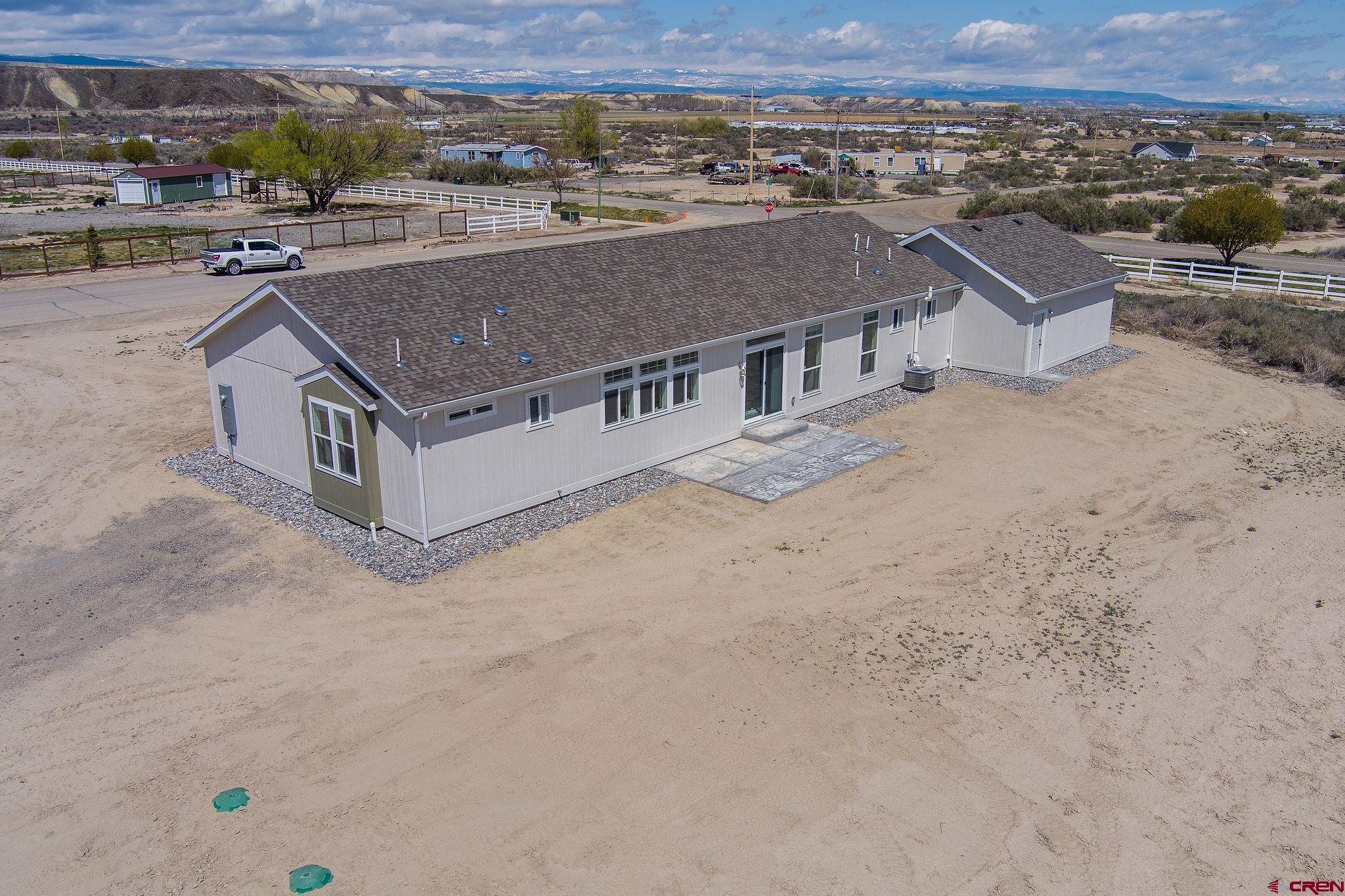 1246 H25 Road Delta, CO 81416 - Photo 24 of 31 an aerial view of a house with a yard