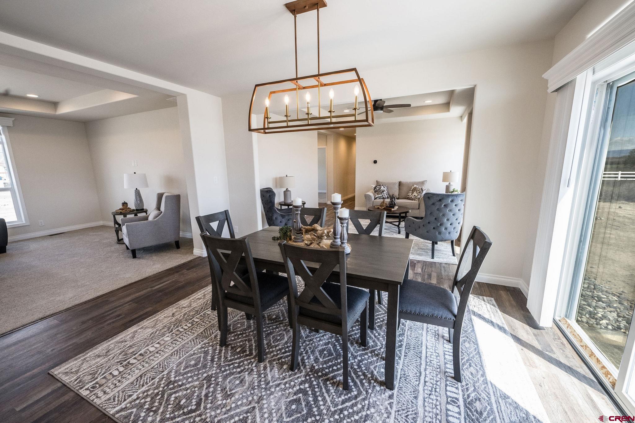 1246 H25 Road Delta, CO 81416 - Photo 5 of 31 a view of a dining room with furniture window and wooden floor